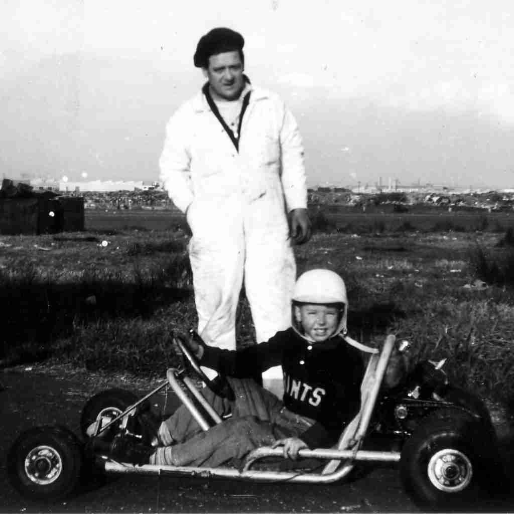 Man in beret and boy in GoKart