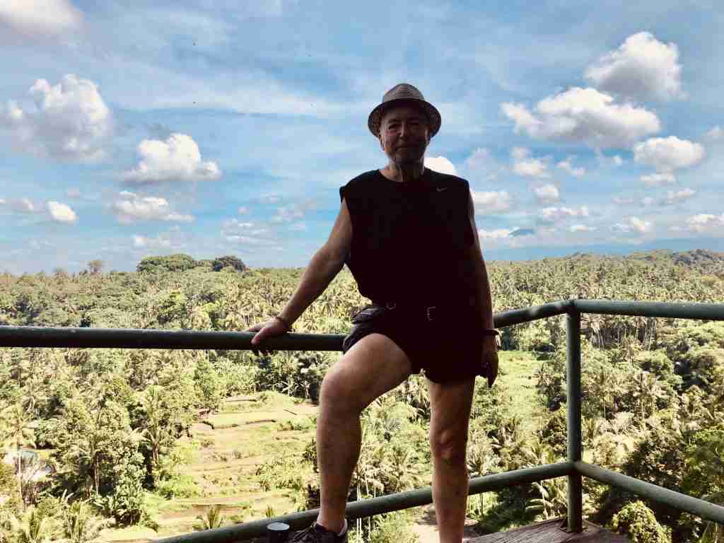 Man standing in front of jungle valley