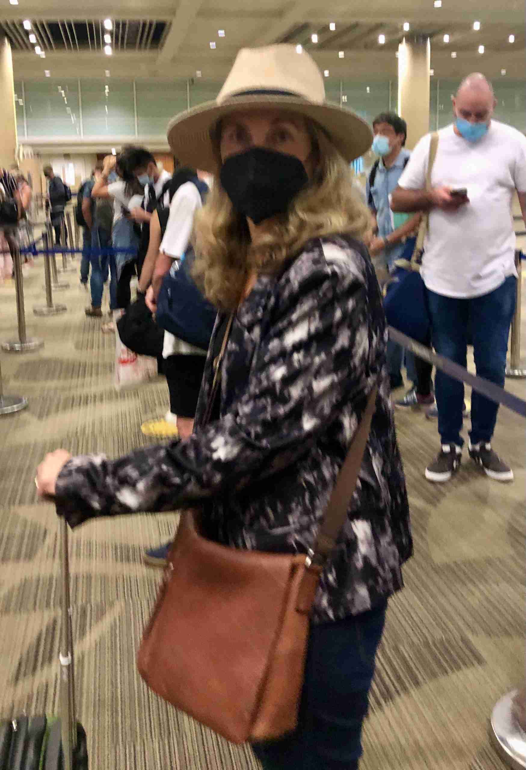 Masked lady at airport