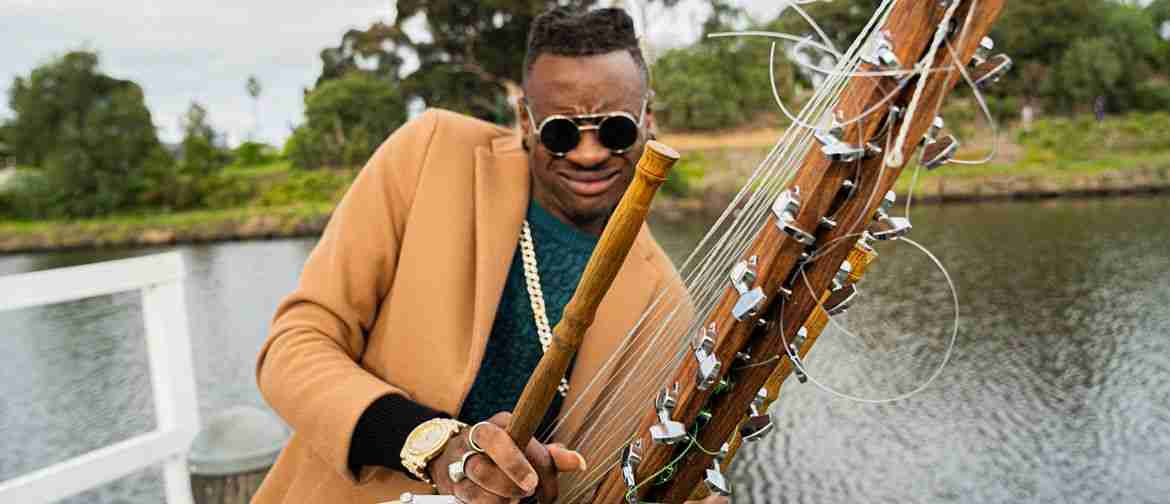 African musician playing Kora