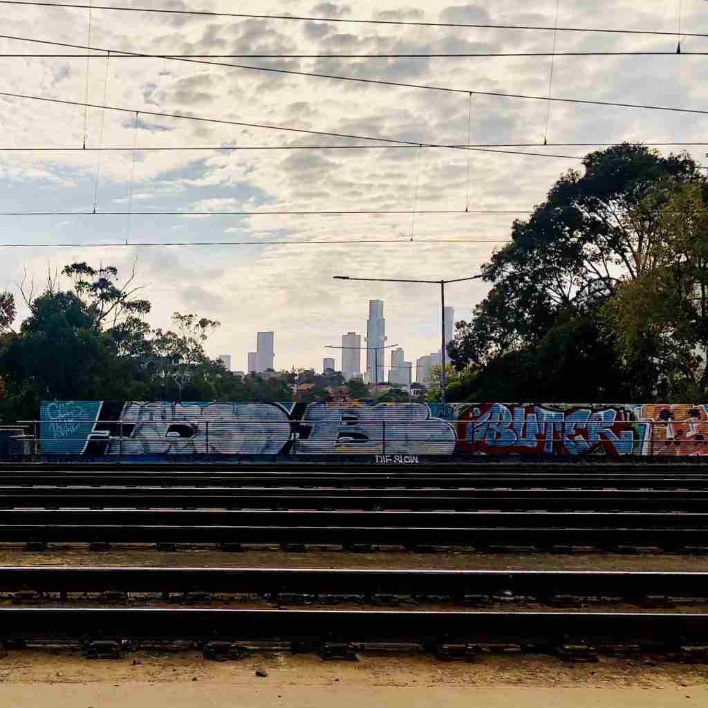 Train tracks and city skyline