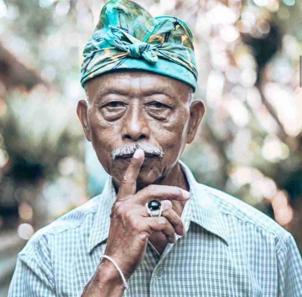 Balinese man with finger on his lip